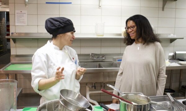 two women discus on the kitchen